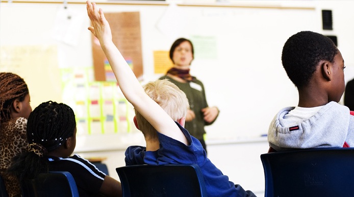 young student rasing his hand