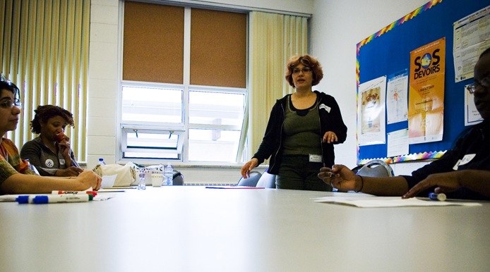 teacher teaching around a table